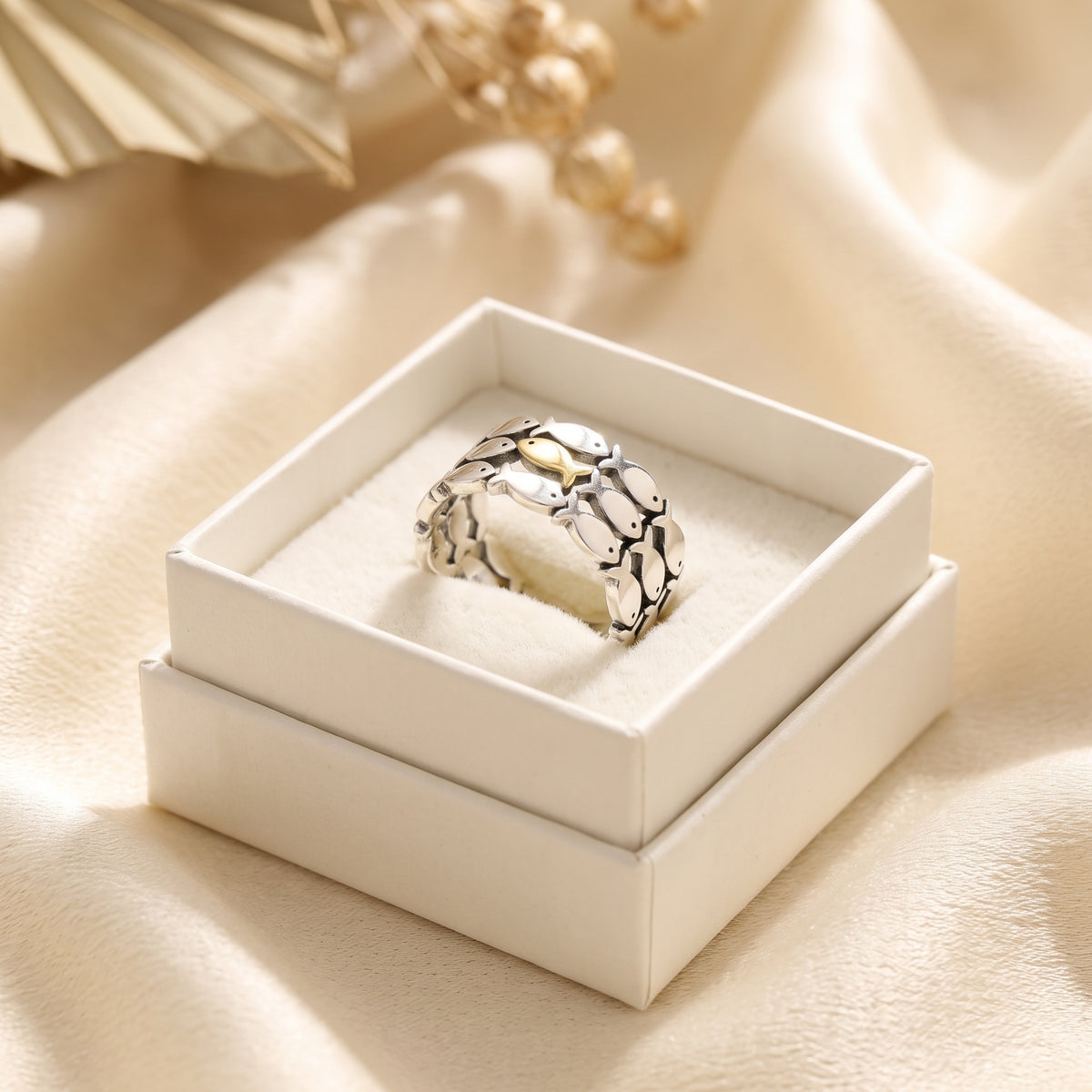 Swim Against the Current ring in its gift box
