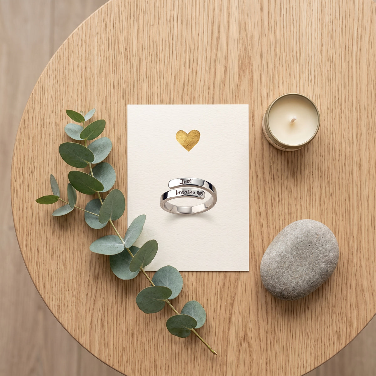 Just Breathe ring on a keepsake card with eucalyptus