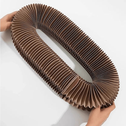 The cardboard scratcher stretched open into a long oval